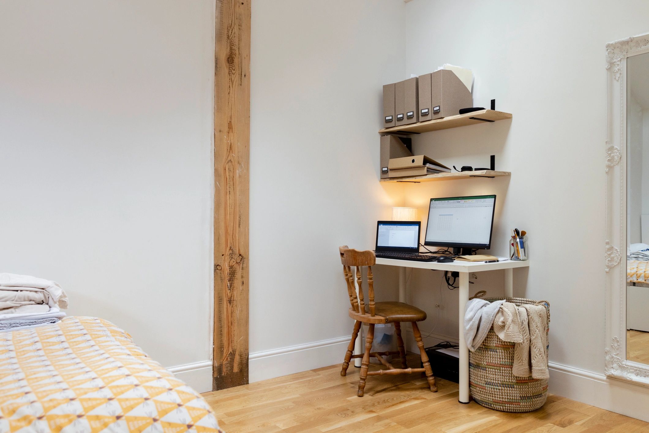 Modern editorial workspace with dual monitors and a tidy desk