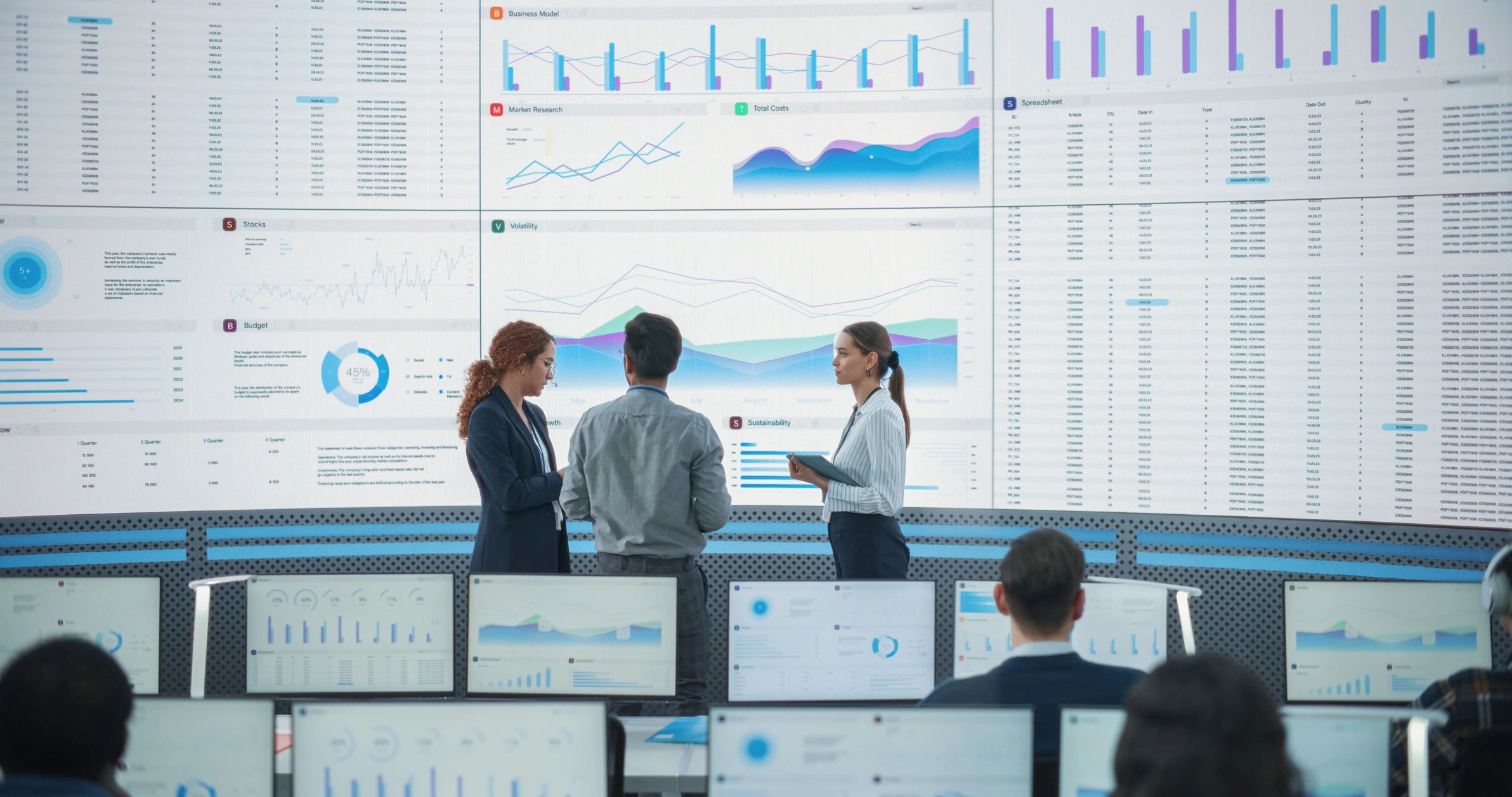 Editorial team reviewing AI dashboards in a modern newsroom